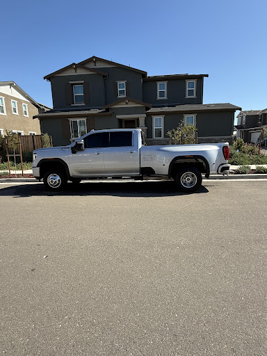 Detailed white GMC Sierra dually truck